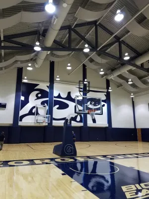 A basketball court with a basket ball hoop.